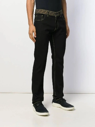 Shop Fendi Monogram Waistband Jeans Black Brown