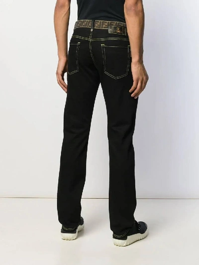 Shop Fendi Monogram Waistband Jeans Black Brown