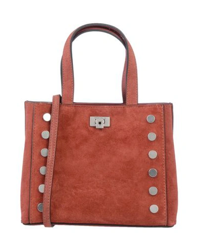 Shop Coccinelle Handbag In Brick Red