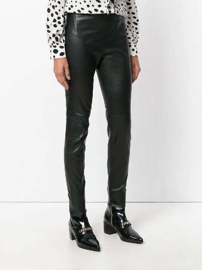 Shop Saint Laurent Mid Waist Leather Leggings In Black