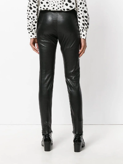 Shop Saint Laurent Mid Waist Leather Leggings In Black