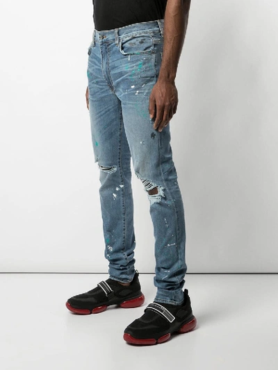 Shop Amiri Paint Splatter Distressed Jeans Indigo