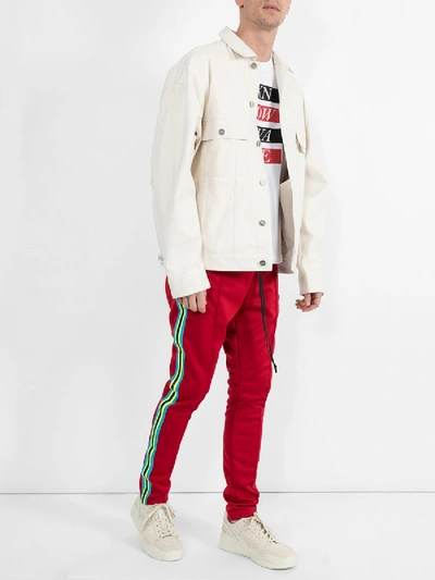 Shop Amiri Skinny Trackpants Red