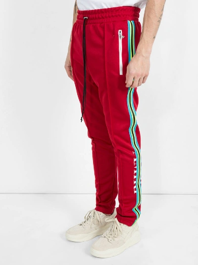 Shop Amiri Skinny Trackpants Red