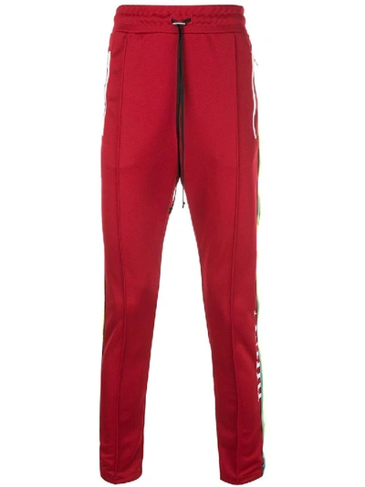 Shop Amiri Skinny Trackpants Red