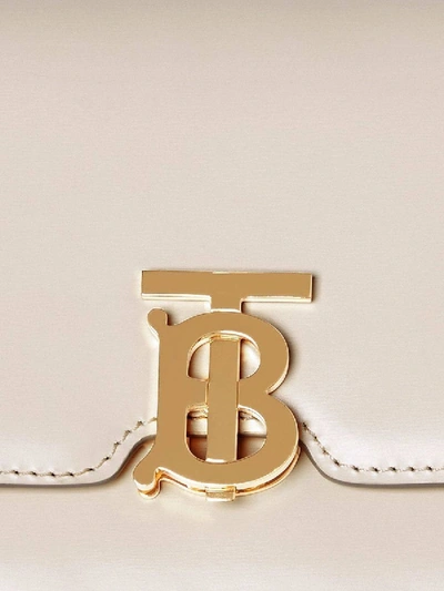 Shop Burberry Leather Belted Tb Bag In Neutral