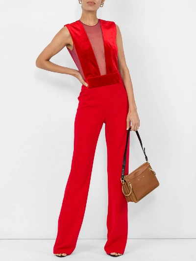 Shop Galvan Velvet Gwyneth Jumpsuit Red