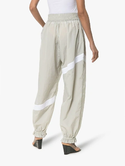 Shop Ganni Striped Flared Cuff Track Pants In Grey