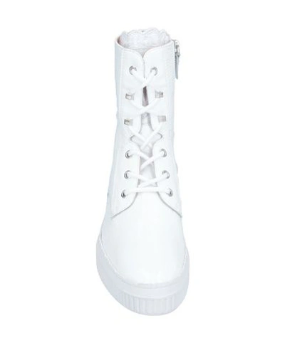 Shop Tod's Ankle Boots In White