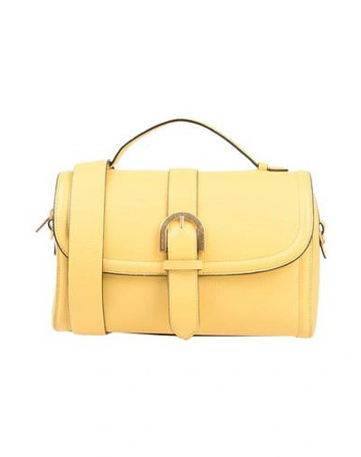 Shop Coccinelle Handbag In Yellow