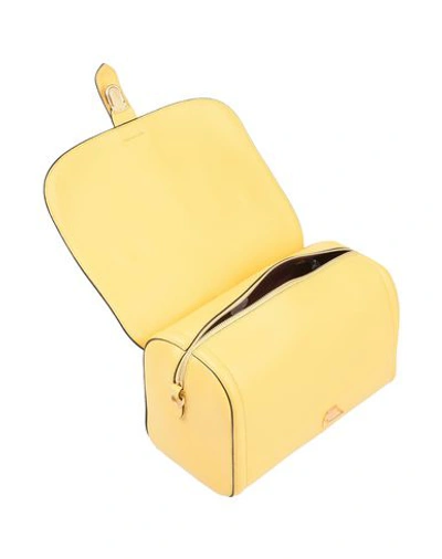 Shop Coccinelle Handbag In Yellow