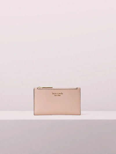 Shop Kate Spade Spencer Small Slim Bifold Wallet In Rosy Cheeks