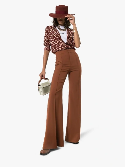 Shop Chloé High-waisted Flared Trousers In Brown