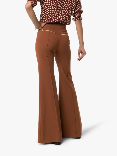 Shop Chloé High-waisted Flared Trousers In Brown