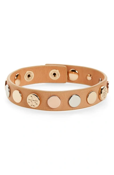 Shop Tory Burch Logo Studded Single Wrap Bracelet In Vachetta /gld/silv/rosegold