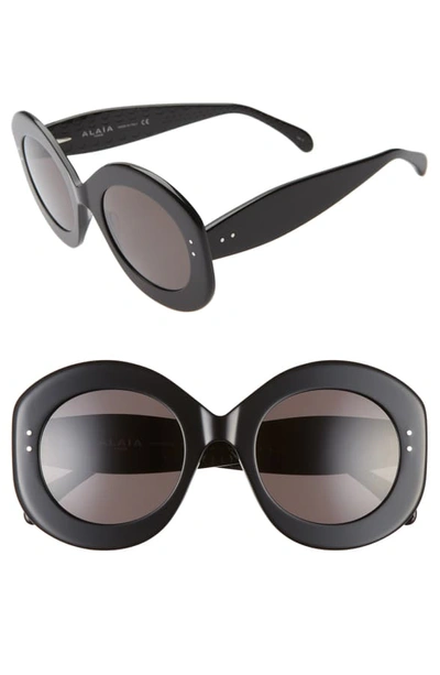 Shop Alaïa 52mm Round Sunglasses - Black