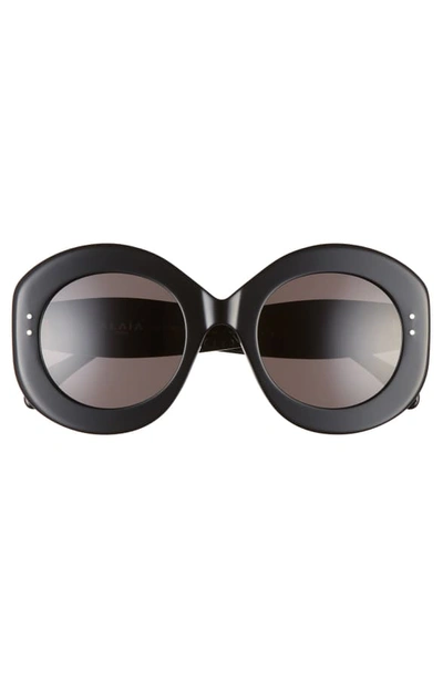 Shop Alaïa 52mm Round Sunglasses - Black