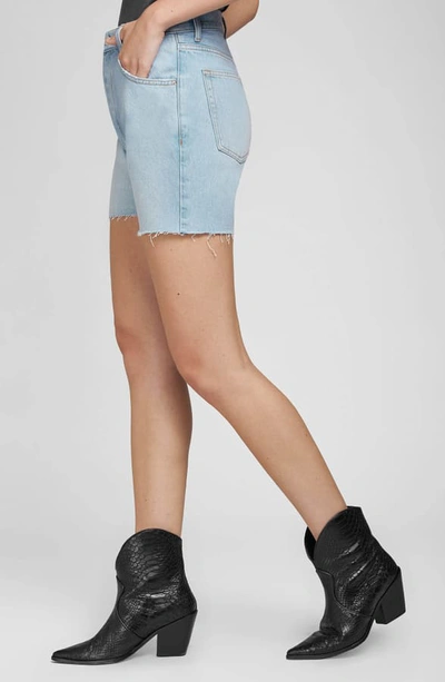 Shop Anine Bing Bonnie Raw Hem Cutoff Denim Shorts In Blue