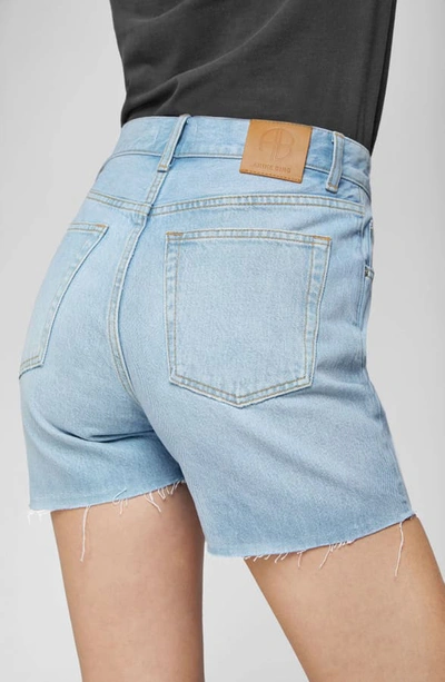 Shop Anine Bing Bonnie Raw Hem Cutoff Denim Shorts In Blue