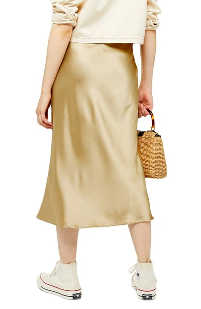 Shop Topshop Satin Bias Midi Skirt In Gold