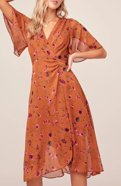Shop Astr Delaney Faux Wrap Flutter Sleeve Dress In Rust-fuchsia Floral