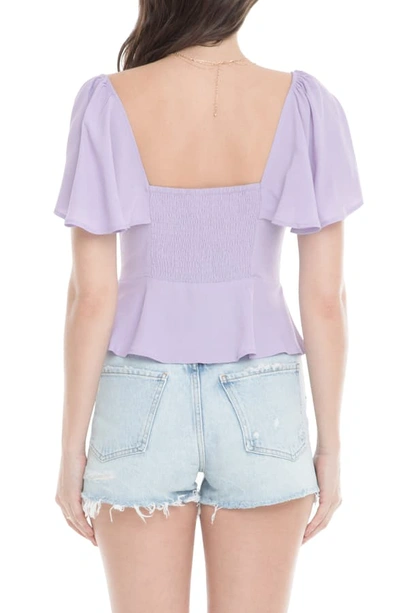 Shop Astr Gwen Front Tie Ruffle Sleeve Peplum Top In Lavender