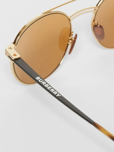 Shop Burberry Top Bar Detail Round Frame Sunglasses In Tortoiseshell