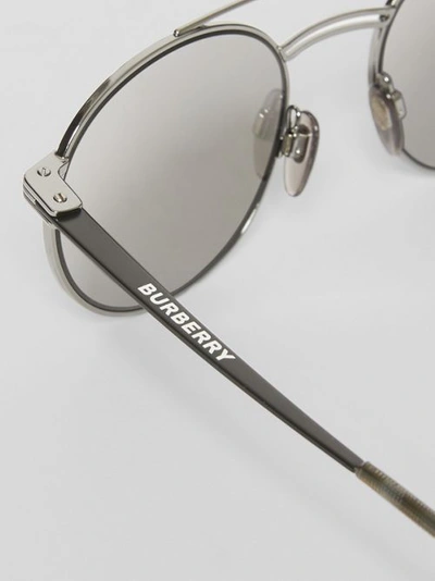 Shop Burberry Top Bar Detail Round Frame Sunglasses In Gunmetal Grey