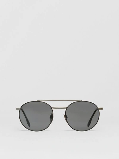Shop Burberry Top Bar Detail Round Frame Sunglasses In Gunmetal/dark Green