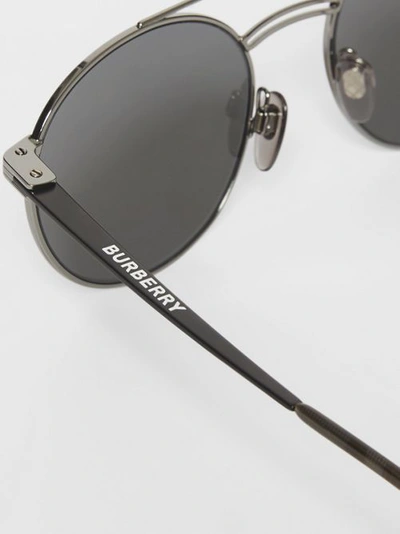 Shop Burberry Top Bar Detail Round Frame Sunglasses In Gunmetal/dark Green