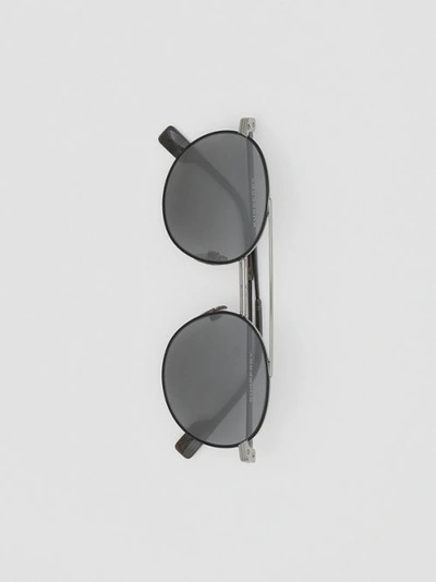 Shop Burberry Top Bar Detail Round Frame Sunglasses In Gunmetal/dark Green