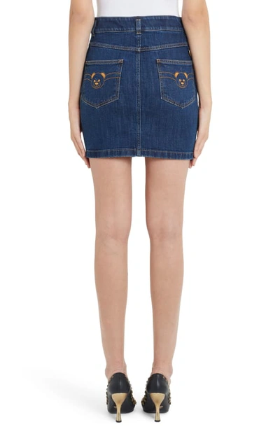 Shop Moschino Embroidered Bear Denim Miniskirt In Blue