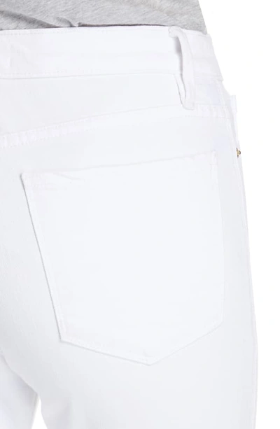 Shop Frame Le Sylvie Slit Hem Ankle Slim Jeans In Blanc