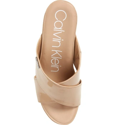 Shop Calvin Klein Jacolyn Wedge Slide Sandal In Desert Sand Leather