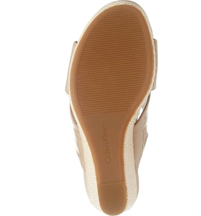 Shop Calvin Klein Jacolyn Wedge Slide Sandal In Desert Sand Leather