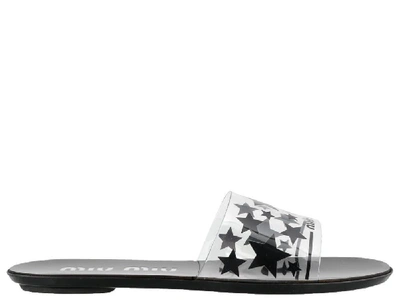 Shop Miu Miu Star Print Slip On Sandals In Black