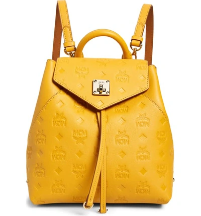 Shop Mcm Essential Monogram Leather Small Backpack - Yellow In Golden Mango