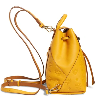 Shop Mcm Essential Monogram Leather Small Backpack - Yellow In Golden Mango