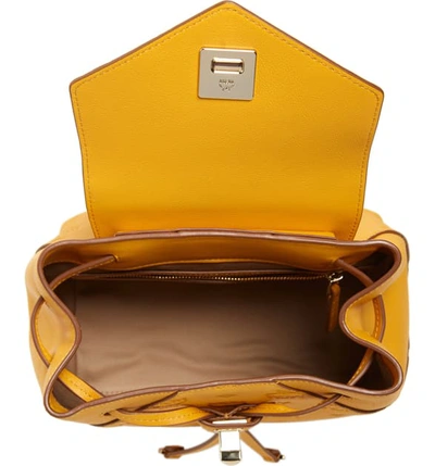 Shop Mcm Essential Monogram Leather Small Backpack - Yellow In Golden Mango