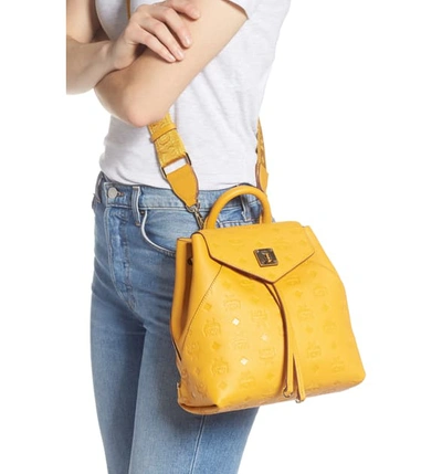 Shop Mcm Essential Monogram Leather Small Backpack - Yellow In Golden Mango