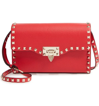 Shop Valentino Medium Rockstud Leather Crossbody Bag In Rouge Pur