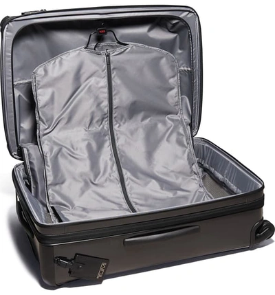 Shop Tumi Tegra-lite Medium Trip 29-inch Expandable Four Wheel Suitcase In Black/ Black