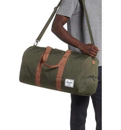 Shop Herschel Supply Co Duffle Bag - Green In Dark Olive/ Saddle Brown