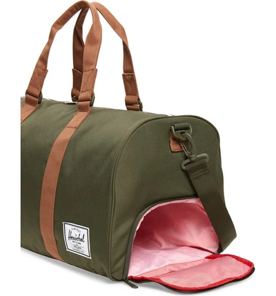 Shop Herschel Supply Co Duffle Bag - Green In Dark Olive/ Saddle Brown