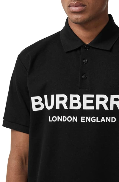 Shop Burberry Luckland Logo Print Pique Polo In Black