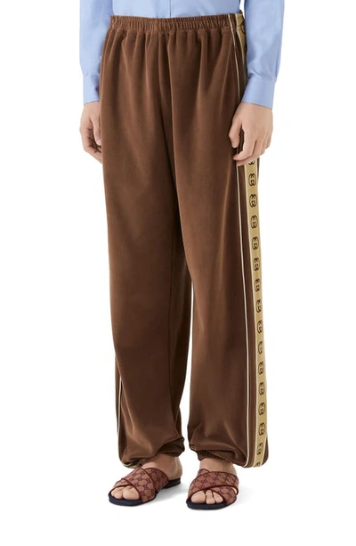 Shop Gucci Interlocking-g Stripe Velour Jogger Pants In Brown/camel/white