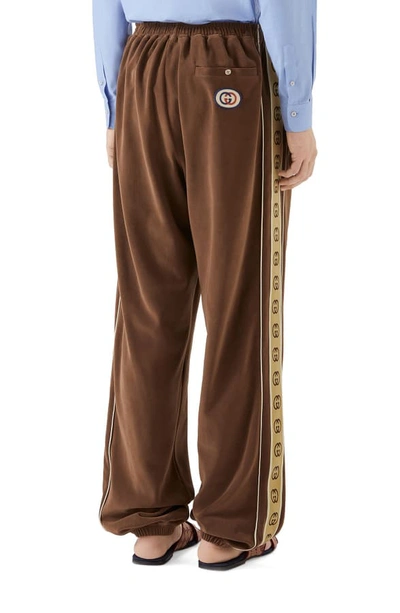 Shop Gucci Interlocking-g Stripe Velour Jogger Pants In Brown/camel/white