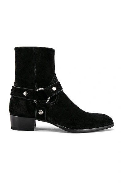 Shop Saint Laurent Wyatt Suede Harness Boots In Black