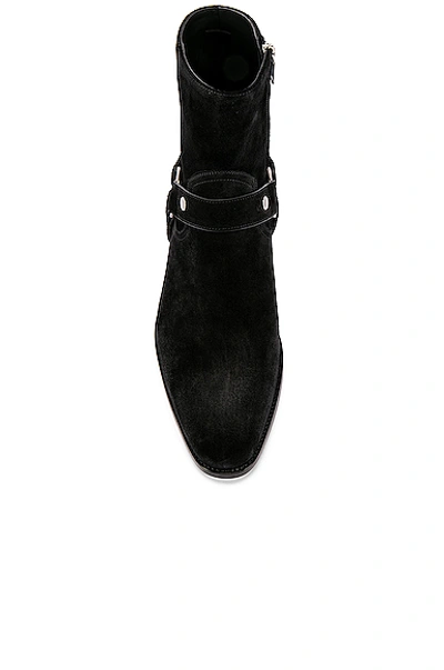 Shop Saint Laurent Wyatt Suede Harness Boots In Black