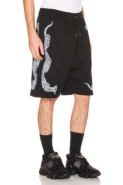 Shop Givenchy Snake Print Bermuda Shorts In Black